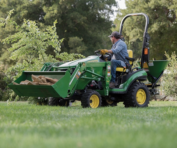 Man driving a John Deere tractor - 13096